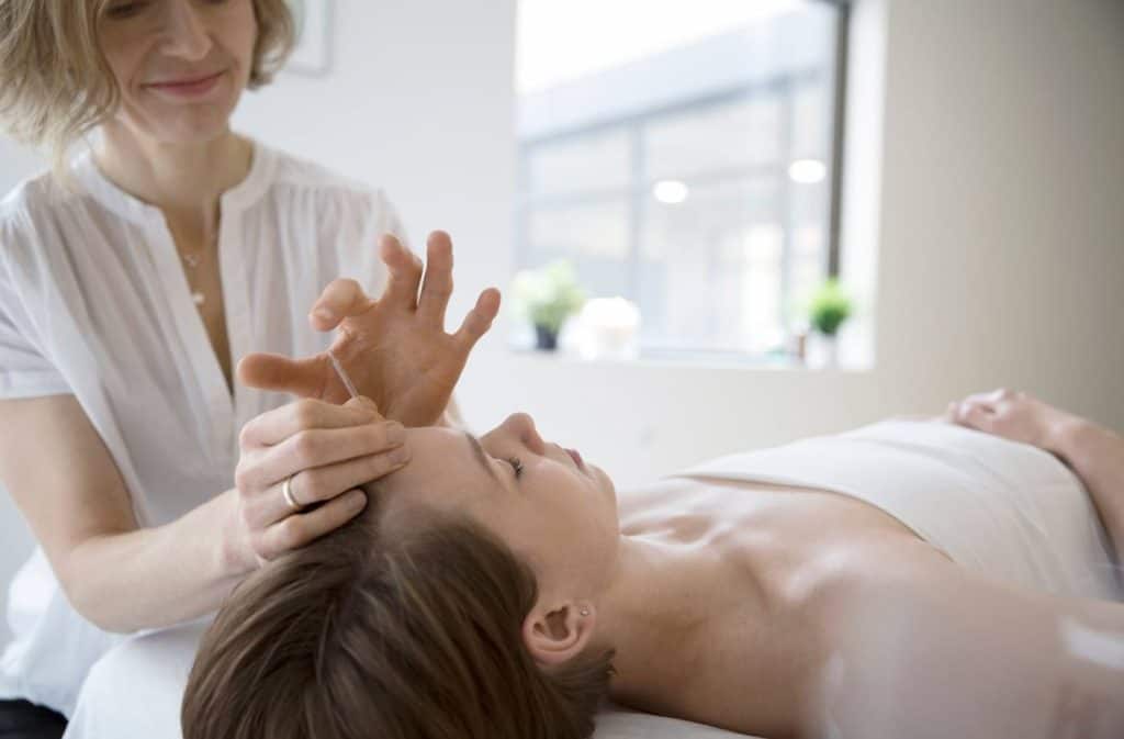 woman having acupuncture